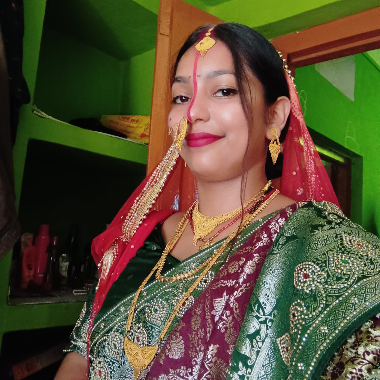 Bhabhi smiling in her beautiful wedding saree